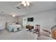 Comfortable main bedroom featuring ceiling fan, carpeted floors and lots of natural light at 5303 Cottonwood Tree Cir, Valrico, FL 33596