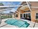 Enclosed pool area featuring a sparkling pool, comfortable lounge chairs, and ample space for relaxation at 5303 Cottonwood Tree Cir, Valrico, FL 33596