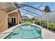 Enclosed pool area featuring a clean design, patio seating, and clear views for tranquil relaxation at 5303 Cottonwood Tree Cir, Valrico, FL 33596
