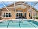 Screened-in pool with patio area, outdoor seating, and a well-maintained backyard and landscaping at 5303 Cottonwood Tree Cir, Valrico, FL 33596