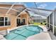 Sparkling screened-in pool area with cozy lounge chairs and views of the landscaped backyard, perfect for relaxing at 5303 Cottonwood Tree Cir, Valrico, FL 33596