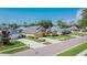 Charming single-Gathering home with a well-manicured lawn, mature landscaping, and a paved driveway at 5303 Cottonwood Tree Cir, Valrico, FL 33596