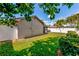 Fenced backyard showing lush green grass and mature landscaping at 5435 20Th N Ave, St Petersburg, FL 33710