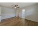 Bedroom featuring hardwood floors, ceiling fan, an ensuite bathroom and closet at 5435 20Th N Ave, St Petersburg, FL 33710