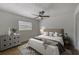 Stylishly furnished bedroom featuring a ceiling fan, natural light, and wood-look flooring at 5435 20Th N Ave, St Petersburg, FL 33710