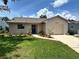 Charming single-story home featuring a well-manicured lawn and freshly landscaped garden beds at 5435 20Th N Ave, St Petersburg, FL 33710