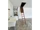 Clean garage showcasing a sink, utility connections, and an attic access ladder at 5435 20Th N Ave, St Petersburg, FL 33710