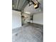 View of the garage showing a sink, utility access, and plenty of open space at 5435 20Th N Ave, St Petersburg, FL 33710