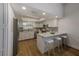 Bright kitchen showcasing white cabinets, stainless steel appliances, and a counter with bar stool seating at 5435 20Th N Ave, St Petersburg, FL 33710