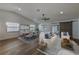 Open-concept living space with hardwood floors, modern furnishings, and ample natural light at 5435 20Th N Ave, St Petersburg, FL 33710