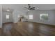 Bright, open living space with wood floors, showcasing the kitchen and access to other areas at 5435 20Th N Ave, St Petersburg, FL 33710