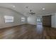 Spacious, bright living room featuring vaulted ceilings, wood floors, and a sliding barn door at 5435 20Th N Ave, St Petersburg, FL 33710