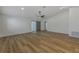 Spacious open-concept living room featuring wood-look flooring, high ceilings, and lots of natural light at 5435 20Th N Ave, St Petersburg, FL 33710