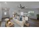 Inviting living area with wood floors seamlessly connecting the dining and kitchen spaces at 5435 20Th N Ave, St Petersburg, FL 33710