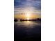 Aerial view of a tranquil sunset reflecting over the water, with treelined shores at 6009 Sea Ranch Dr # 306, Hudson, FL 34667