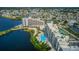 Stunning aerial view of waterfront condos with pools, sandy beach and picturesque bay views at 6009 Sea Ranch Dr # 306, Hudson, FL 34667