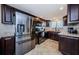 Updated kitchen featuring stainless steel appliances and a window for natural light at 6009 Sea Ranch Dr # 306, Hudson, FL 34667