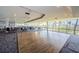 Spacious recreation room featuring a ceiling fan and large windows offering natural light and views at 6009 Sea Ranch Dr # 306, Hudson, FL 34667