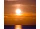 Striking sunset over the ocean, highlighting the bright horizon at 6009 Sea Ranch Dr # 306, Hudson, FL 34667