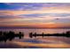 Beautiful sunset reflecting on the bay with islands and trees in silhouette at 6009 Sea Ranch Dr # 306, Hudson, FL 34667