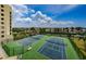 Enjoy a match on the well-maintained tennis courts with lush landscaping and beautiful sky views at 6009 Sea Ranch Dr # 306, Hudson, FL 34667