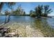 Enjoy the peaceful water view from this waterfront property, set against a backdrop of clear skies at 6009 Sea Ranch Dr # 306, Hudson, FL 34667