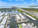 Aerial view of waterfront townhomes with boat docks offering scenic views and convenient access at 6049 Moorings S Dr, St Petersburg, FL 33712