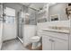 This bathroom showcases a glass-enclosed shower, modern fixtures, and stylish tile work at 6049 Moorings S Dr, St Petersburg, FL 33712