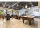 Enjoy the luxurious resident area featuring a pool table, comfortable seating, and modern lighting at 6049 Moorings S Dr, St Petersburg, FL 33712