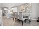 Elegant dining space with sleek table and chairs, open to the kitchen and living areas at 6049 Moorings S Dr, St Petersburg, FL 33712