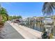 Picturesque waterfront setting along the dock, perfect for boating and enjoying scenic views at 6049 Moorings S Dr, St Petersburg, FL 33712