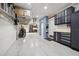 Spacious garage with ample storage, epoxy flooring, and well-organized cabinets at 6049 Moorings S Dr, St Petersburg, FL 33712