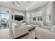 Bright living space with comfortable seating, contemporary decor, and access to a balcony at 6049 Moorings S Dr, St Petersburg, FL 33712