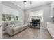 This office has two windows, a pull out sofa, and built in cabinets at 6049 Moorings S Dr, St Petersburg, FL 33712