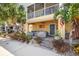 Inviting covered patio with comfortable seating and an American flag accent creates an ideal outdoor retreat at 6049 Moorings S Dr, St Petersburg, FL 33712