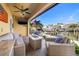 Waterfront patio with plush seating, fire pit, and picturesque marina views, ideal for relaxation at 6049 Moorings S Dr, St Petersburg, FL 33712