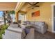 Inviting outdoor patio with comfortable seating, a fire pit, and lovely landscaping at 6049 Moorings S Dr, St Petersburg, FL 33712