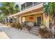 Inviting covered patio with comfortable seating and an American flag accent creates an ideal outdoor retreat at 6049 Moorings S Dr, St Petersburg, FL 33712