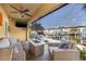 Relaxing waterfront patio with cozy seating, a gas fire pit, and serene views of the boat docks at 6049 Moorings S Dr, St Petersburg, FL 33712