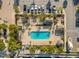 Overhead view of a stunning pool surrounded by lush landscaping and shaded lounge areas for relaxation at 6049 Moorings S Dr, St Petersburg, FL 33712