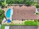 Aerial view showcasing the pool, pergola, roof, yard, and overall property layout at 810 Erik Lake Rd, Brandon, FL 33510