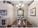 Formal dining room with chandelier, ample seating and elegant decor for memorable gatherings at 810 Erik Lake Rd, Brandon, FL 33510