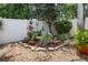 Charming garden featuring decorative rocks, plants, and a bird bath, enhancing the outdoor space at 810 Erik Lake Rd, Brandon, FL 33510
