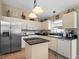Bright kitchen featuring stainless steel appliances, white cabinets and granite counters, ideal for culinary enthusiasts at 810 Erik Lake Rd, Brandon, FL 33510