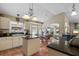 Well lit kitchen featuring stone countertops, pendant lights, and an attached breakfast nook at 810 Erik Lake Rd, Brandon, FL 33510