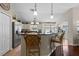 Open kitchen with a large island, stainless steel appliances, and breakfast bar seating at 810 Erik Lake Rd, Brandon, FL 33510
