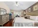 Inviting main bedroom with hardwood floors, a bay window, and stylish decor at 810 Erik Lake Rd, Brandon, FL 33510