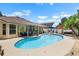Inviting backyard pool with a covered patio, lounge chairs and lush landscaping at 810 Erik Lake Rd, Brandon, FL 33510