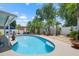 Sparkling pool with ample seating, perfect for outdoor entertaining and relaxation at 810 Erik Lake Rd, Brandon, FL 33510