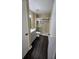 Bathroom with gray vanity, glass shower door, and dark wood floors at 8517 Island Breeze Ln # 207, Temple Terrace, FL 33637